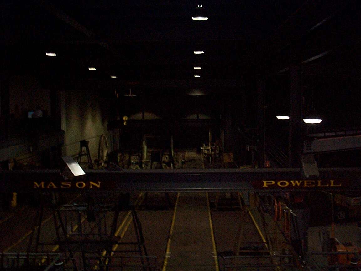 In the background the weights which create the cables tension.